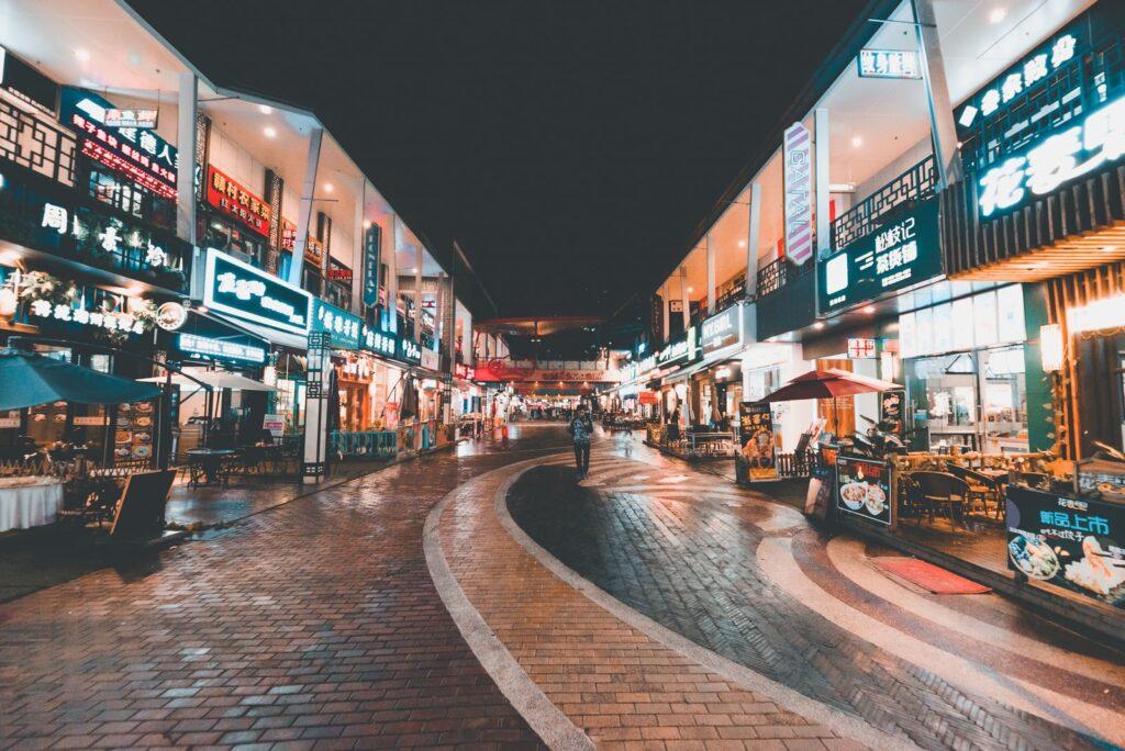 businesses man on road at night